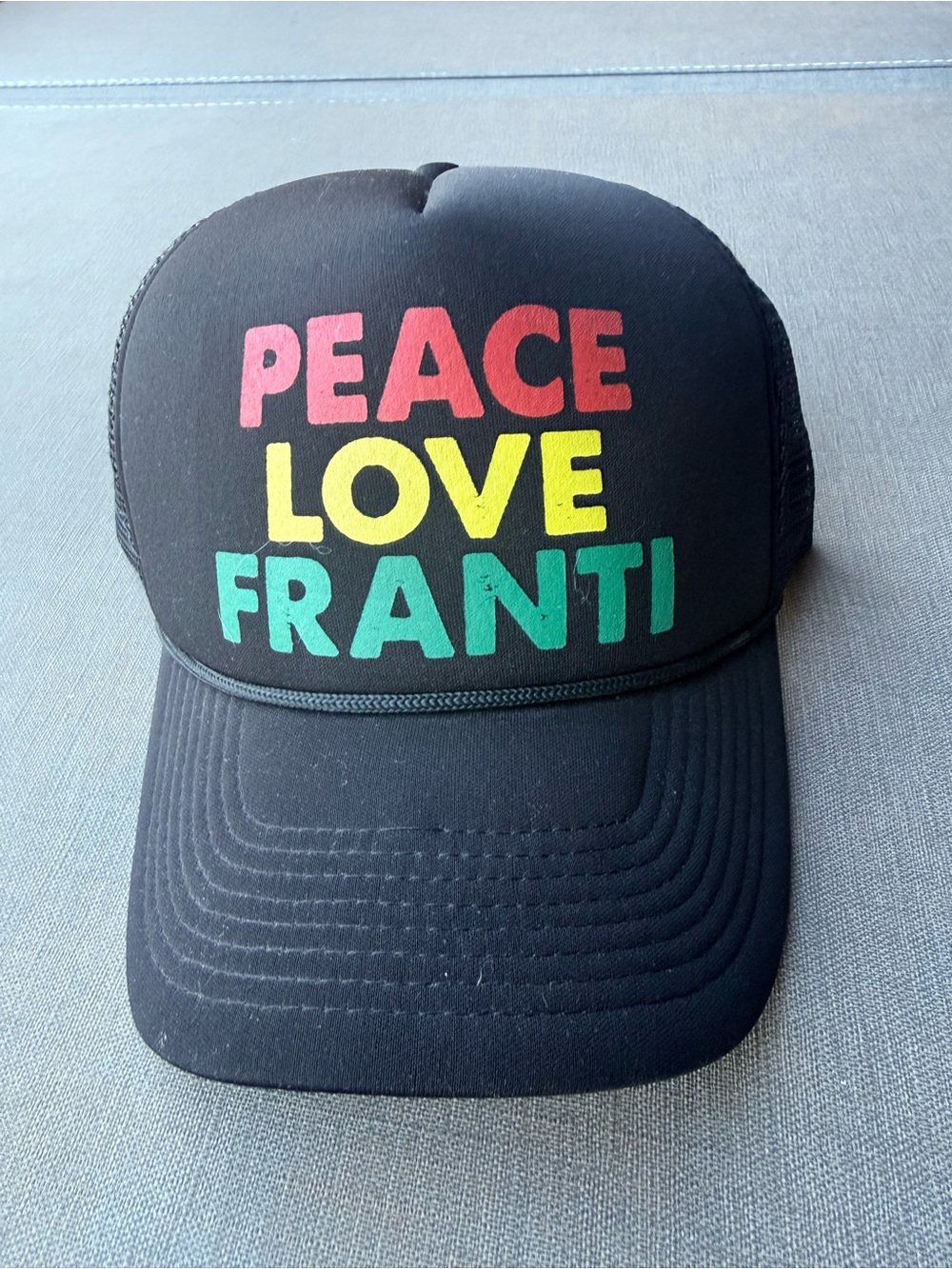 Black Trucker Hat with Red, Yellow & Green "PEACE LOVE FRANTI" Text